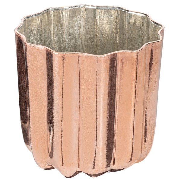 A copper and silver tin-lined cannele mold.