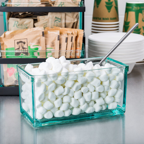 A Cal-Mil clear glass jar filled with white marshmallows.