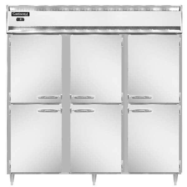 A row of three white Continental reach-in freezers with half doors open.