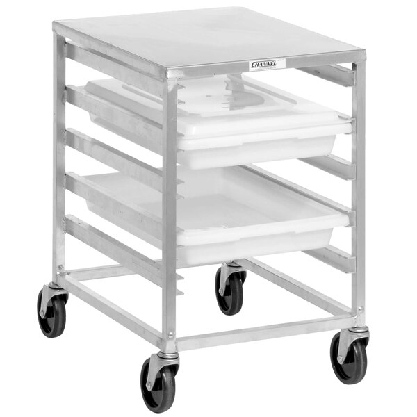 A silver metal cart with aluminum food boxes on it.