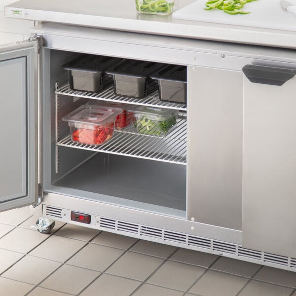 A Beverage-Air stainless steel undercounter refrigerator with an open door.