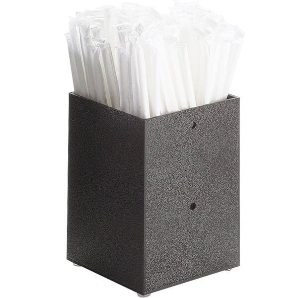 A black container with white straws inside.
