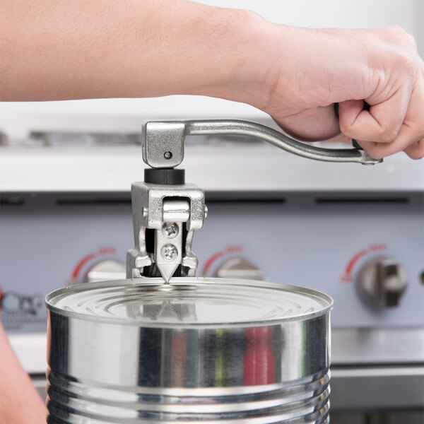 A hand using a Choice Prep Light Duty Manual Can Opener to open a can.
