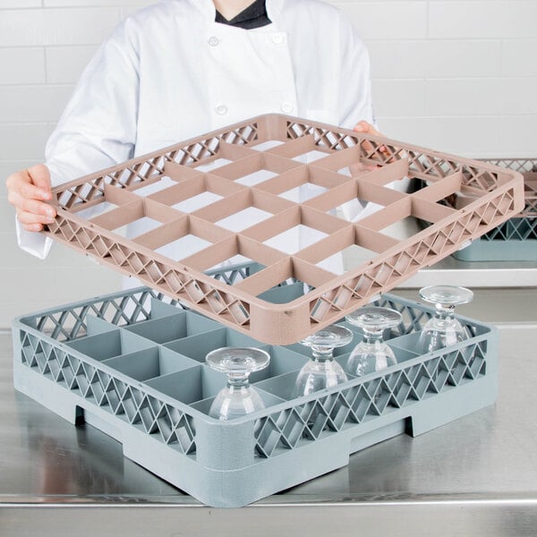A chef using a Noble Products glass rack extender to hold glasses on a tray.