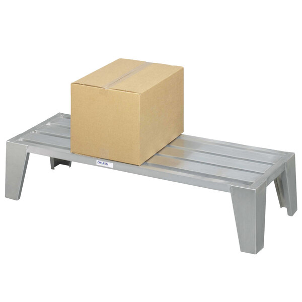 A Channel heavy-duty aluminum dunnage rack with a box on it.