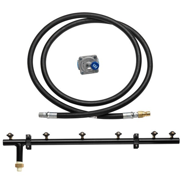 A black hose and metal tube in a Crown Verity liquid propane to natural gas conversion kit.