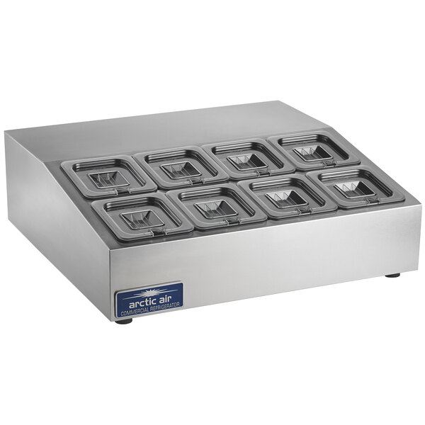 An Arctic Air stainless steel countertop refrigerated prep rail with six compartments and lids.