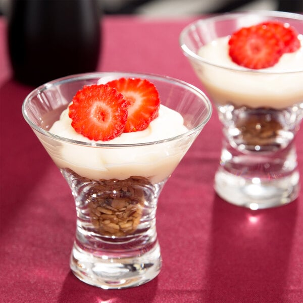 Two Anchor Hocking dessert taster glasses with strawberries and cream.