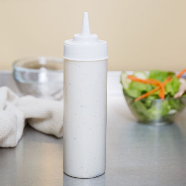 A clear plastic Choice wide mouth squeeze bottle filled with white liquid.
