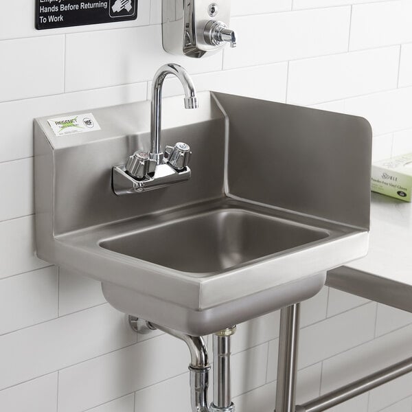 A Regency stainless steel wall mounted hand sink with faucet and right side splash.