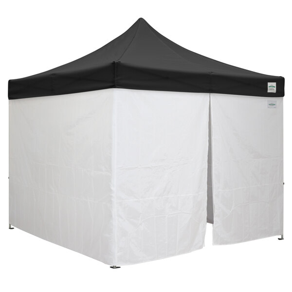 A black Caravan Canopy with a white top.