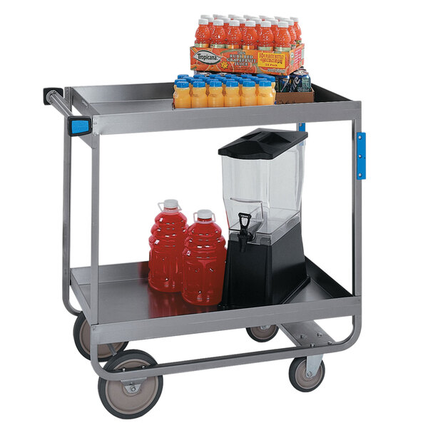 A Lakeside metal utility cart with juices and drinks on it.