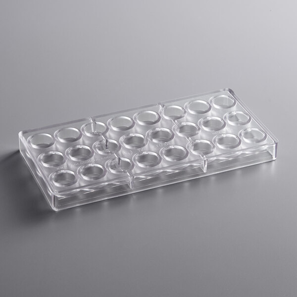 A clear plastic tray with circular compartments.