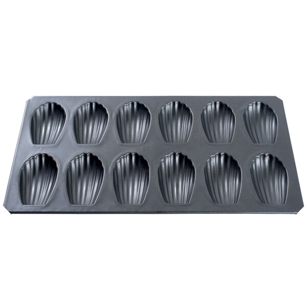 A black baking tray with shell-shaped molds.