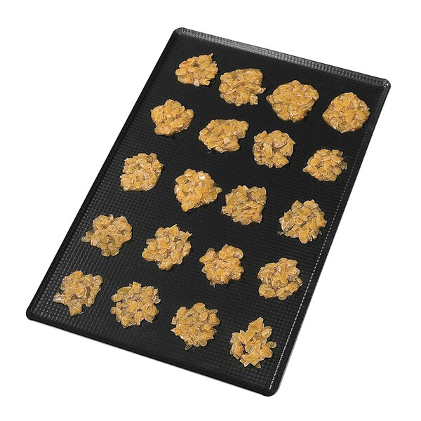 A Matfer Bourgeat aluminum sheet pan with cookies on it.