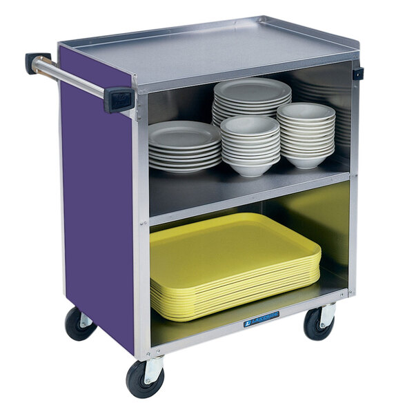 A Lakeside stainless steel utility cart with an enclosed base holding yellow plates.