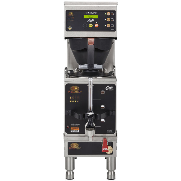 A Curtis G3 Gemini IntelliFresh coffee machine with a black and silver finish and buttons.