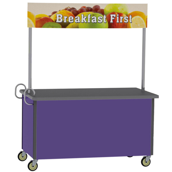 A Lakeside stainless steel vending cart with purple and grey accents and a sign reading "Breakfast First" with fruit on it.
