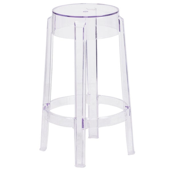 A Flash Furniture clear polycarbonate counter height stool with legs and a seat with a drain hole.