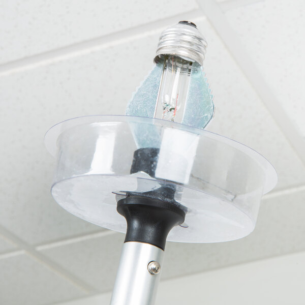 A Unger Bebbe broken light bulb remover attached to a light bulb.