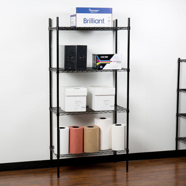 A 360 Office Furniture black wire shelving unit with boxes and rolls of paper towels.