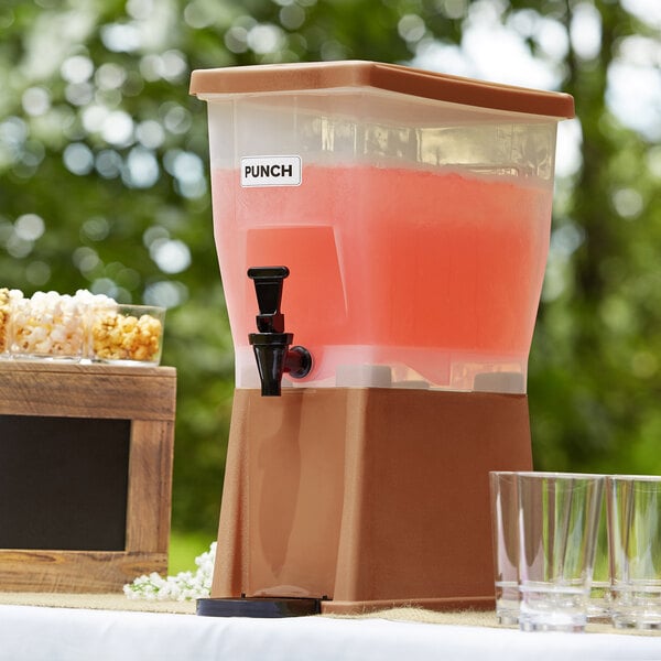 A brown Choice beverage dispenser filled with a beverage.