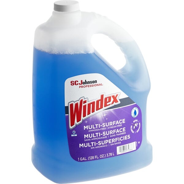 A jug of blue SC Johnson Windex glass cleaner with a white label.