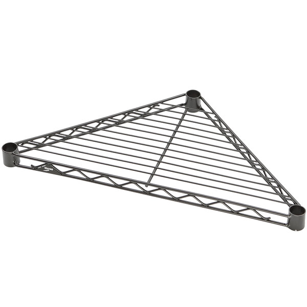 A black triangle-shaped metal shelf with holes.