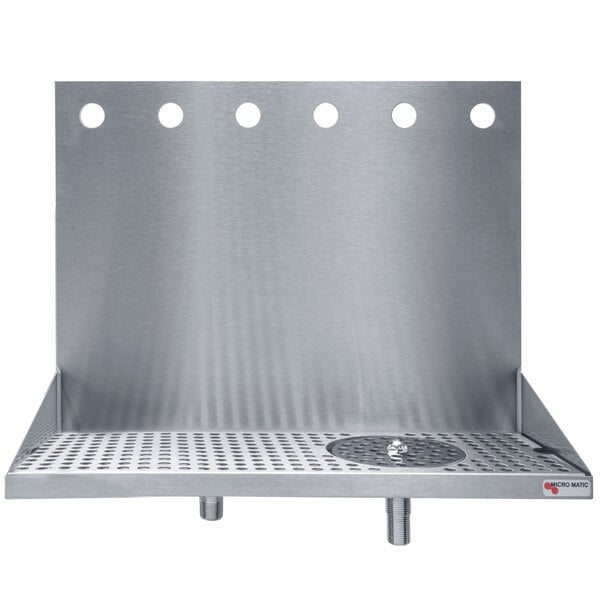 A stainless steel wall mount drip tray with glass rinsers over a metal surface with holes.