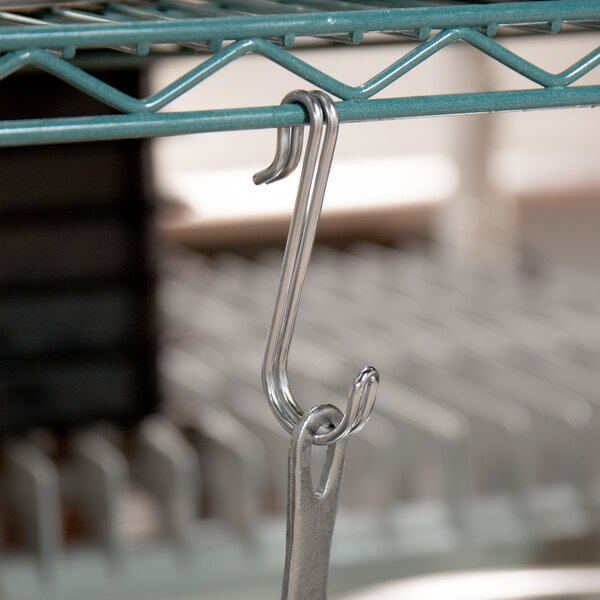 A stainless steel hook from a Metro Super Work Center.