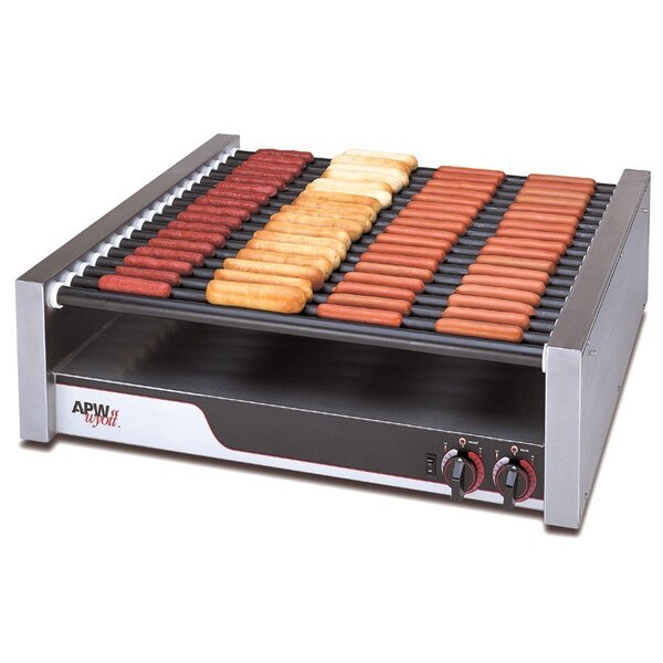 A APW Wyott hot dog grill with hot dogs cooking on it.