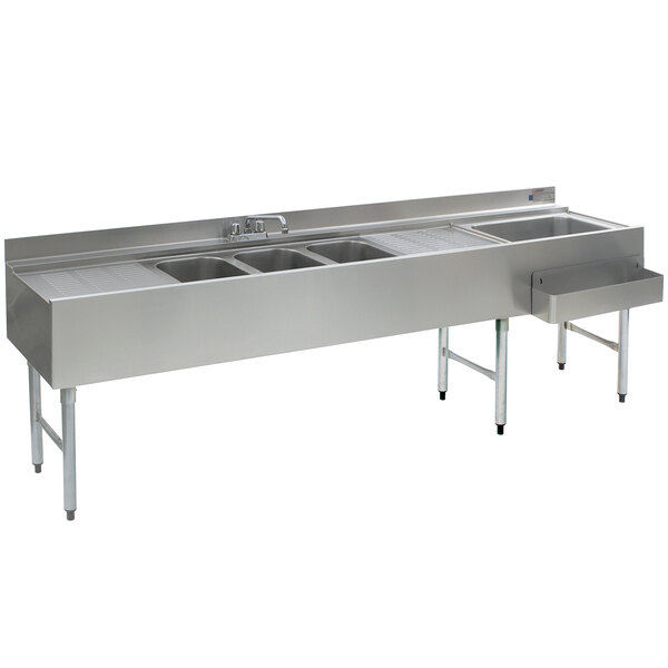 A stainless steel Eagle Group underbar sink and ice bin with three sinks, two drainboards, and a right side ice bin.