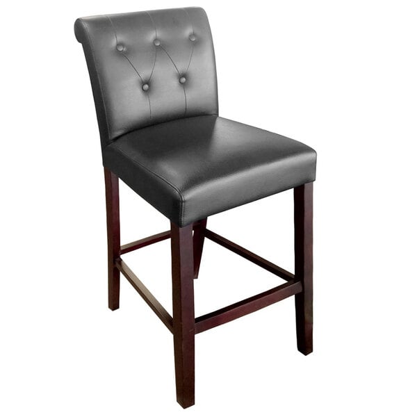 A Holland Bar Stool Arie espresso wood bar stool with black vinyl seat.