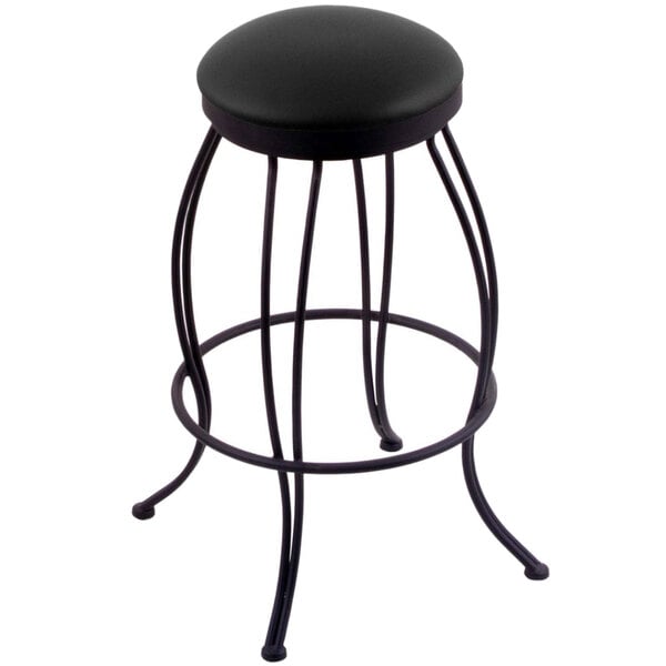A Holland Bar Stool black steel swivel stool with black vinyl seat.