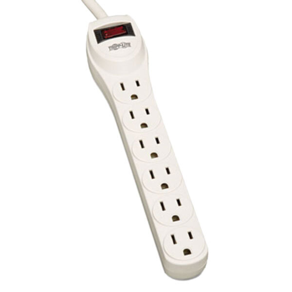 A close-up of a white Tripp Lite surge protector with a red light on it.