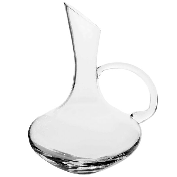 A clear crystal decanter with a handle.