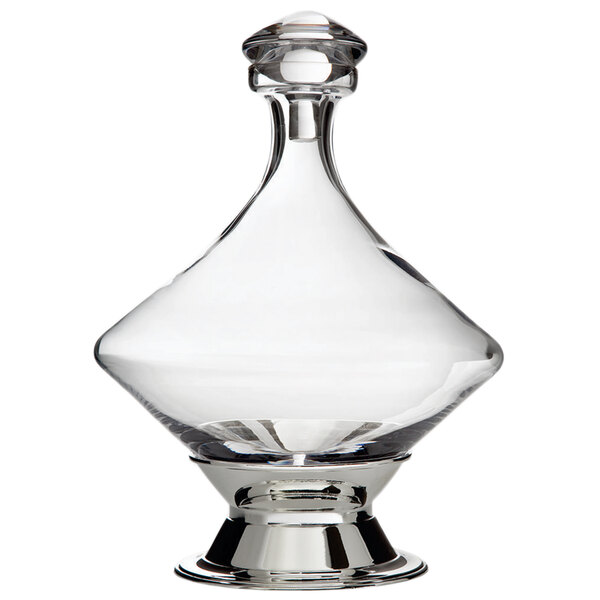 A Franmara Orbital clear glass decanter with a silver base and stopper.
