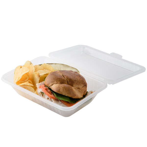 A sandwich and chips in a clear customizable plastic container.