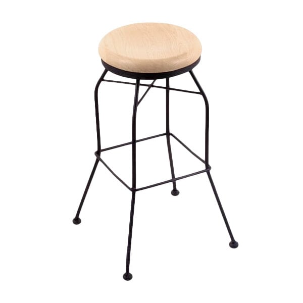 A Holland Bar Stool black wrinkle steel bar height swivel stool with a natural maple wood seat.