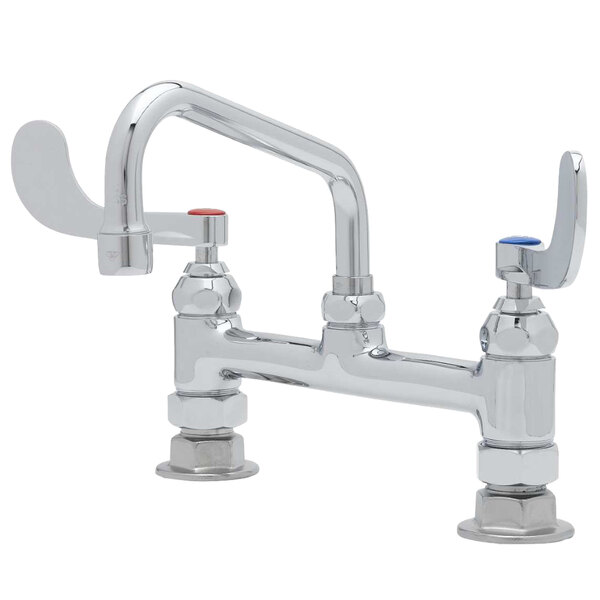 A T&S deck mounted pantry faucet with white wrist handles and a swing spout.