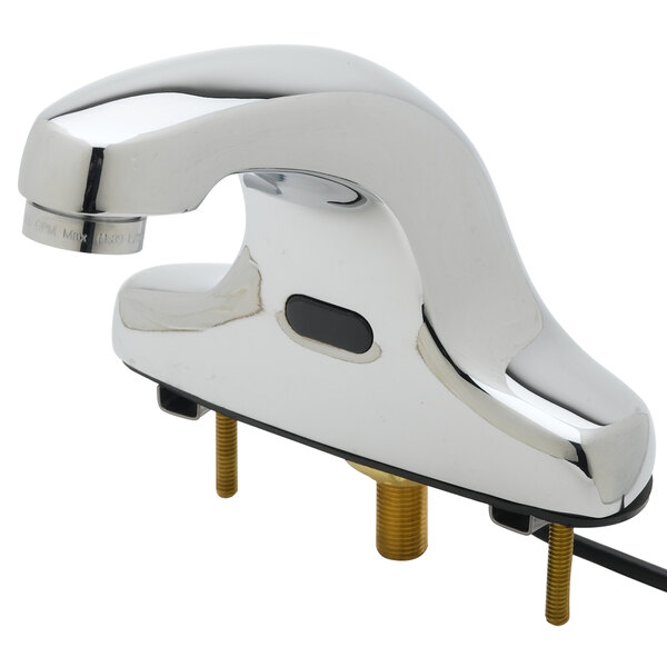 A T&S chrome hands-free bathroom faucet with supply lines.