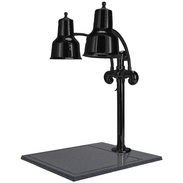 A Hanson Heat Lamps black dual bulb carving station lamp on a black table.