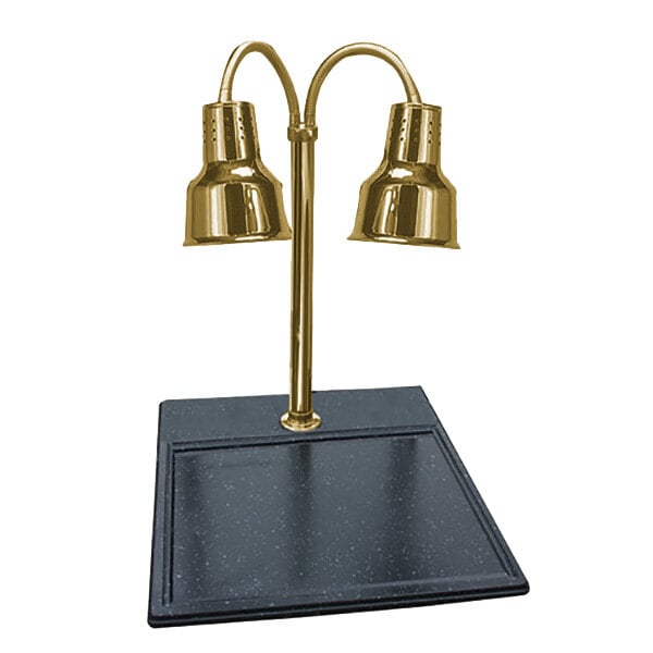 A Hanson Heat Lamps brass carving station with black synthetic granite base and two gold lamps on a black surface.