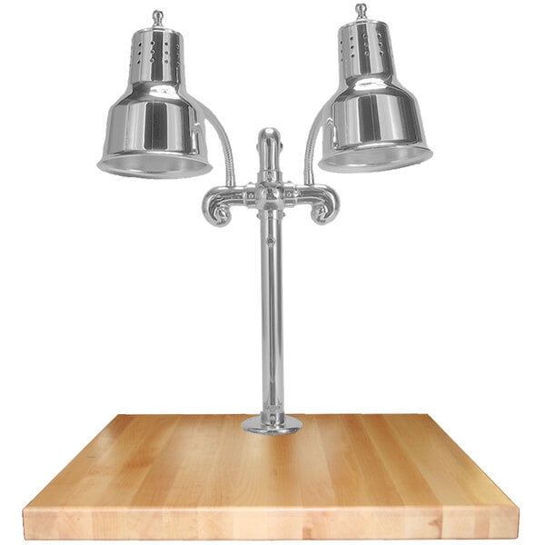 A Hanson Heat Lamps stainless steel carving station with a maple base.