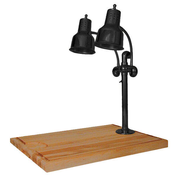 A black Hanson Heat Lamps carving station on a wooden surface.