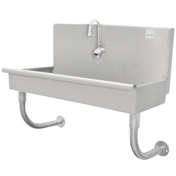 A stainless steel Advance Tabco utility sink with a drain and an electronic faucet.