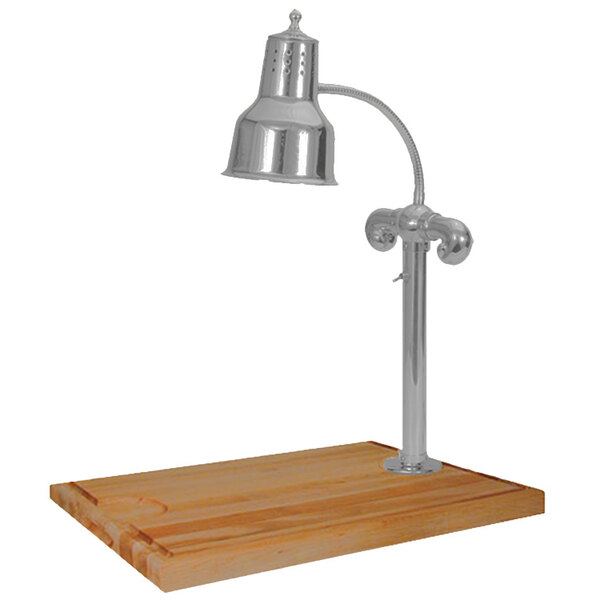 A Hanson Heat Lamps stainless steel carving station with a single silver lamp on a maple wood table.