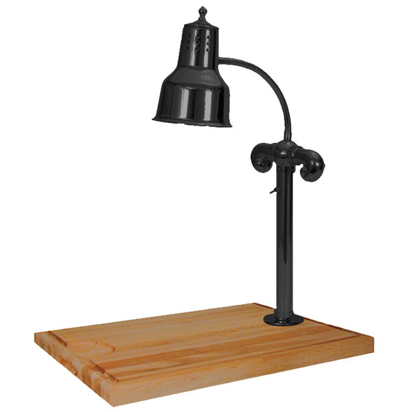 A Hanson Heat Lamps black carving station lamp on a wooden surface.