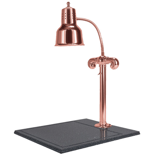 A Hanson bright copper carving lamp on a black synthetic granite base.