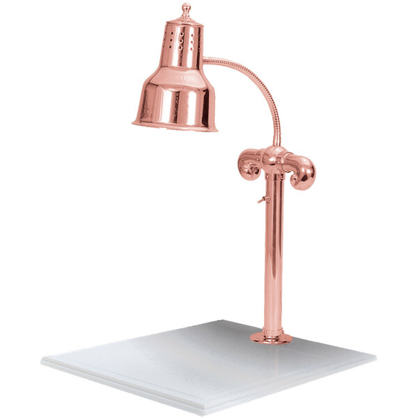 A Hanson Heat Lamps bright copper carving station with white solid base and lamp.